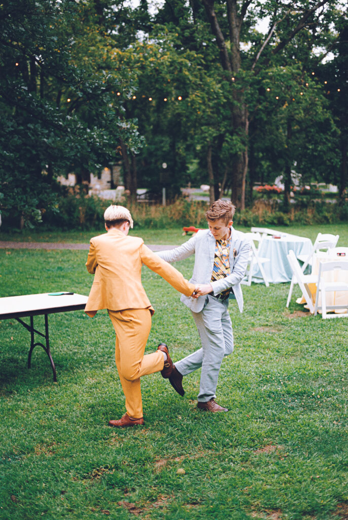 A queer couple celebrates their wedding at The Grove Redfield Estate in Glenview, Illinois.