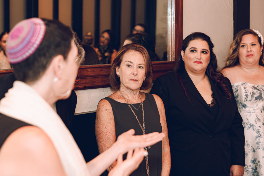 A queer couple celebrates their wedding at Osteria Via Stato