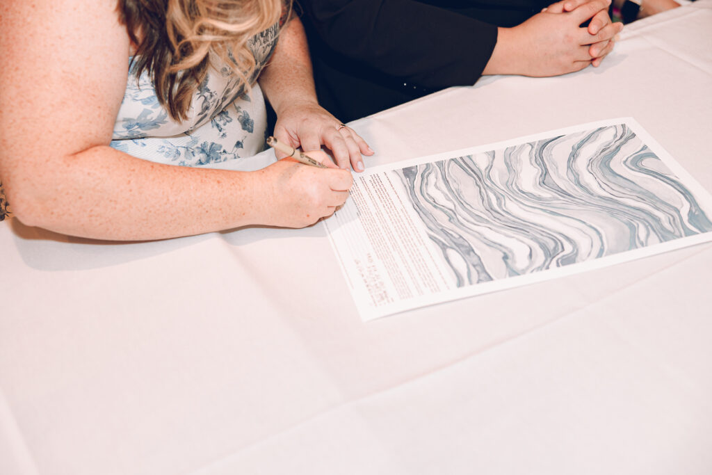 A queer couple celebrates their wedding at Osteria Via Stato