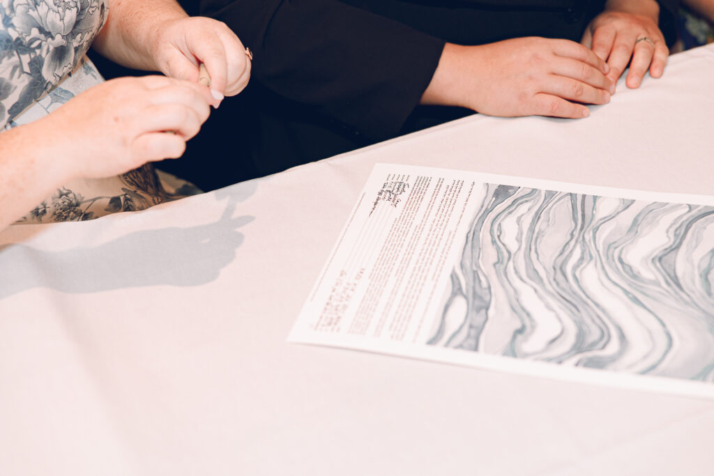 A queer couple celebrates their wedding at Osteria Via Stato