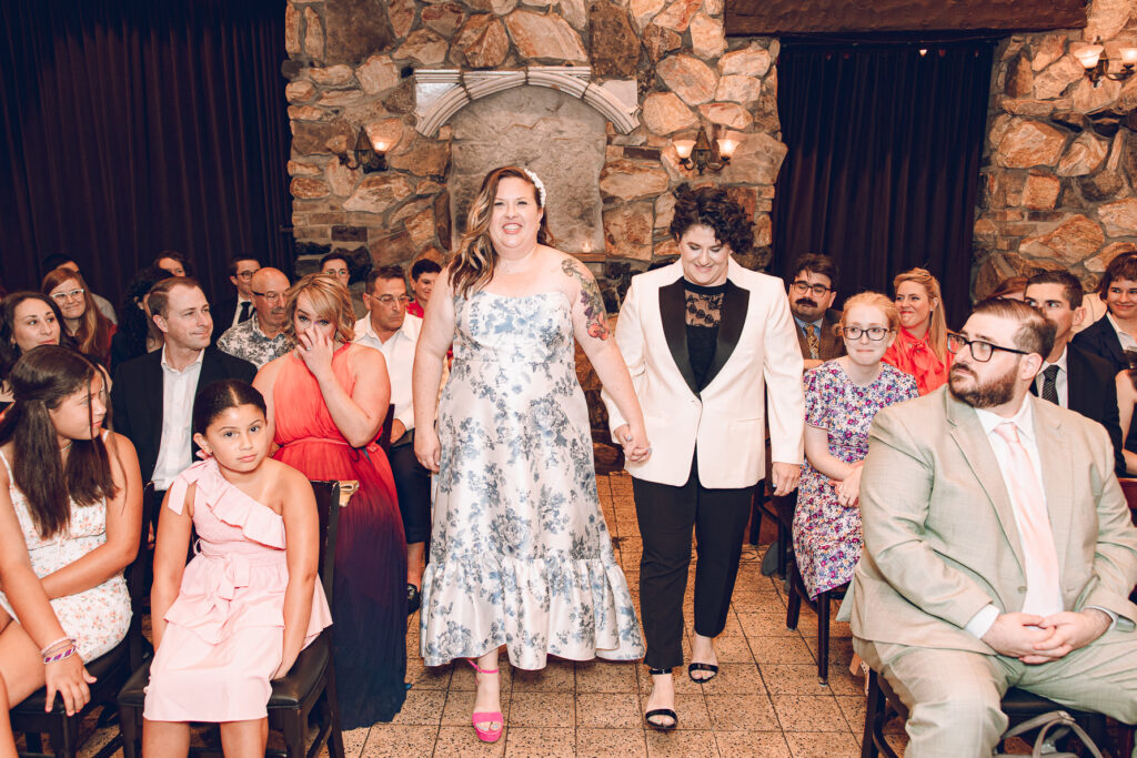 A queer couple celebrates their wedding at Osteria Via Stato