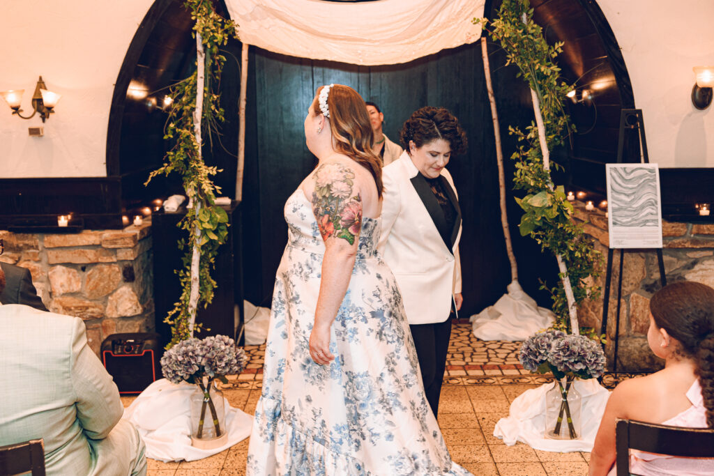 A queer couple celebrates their wedding at Osteria Via Stato