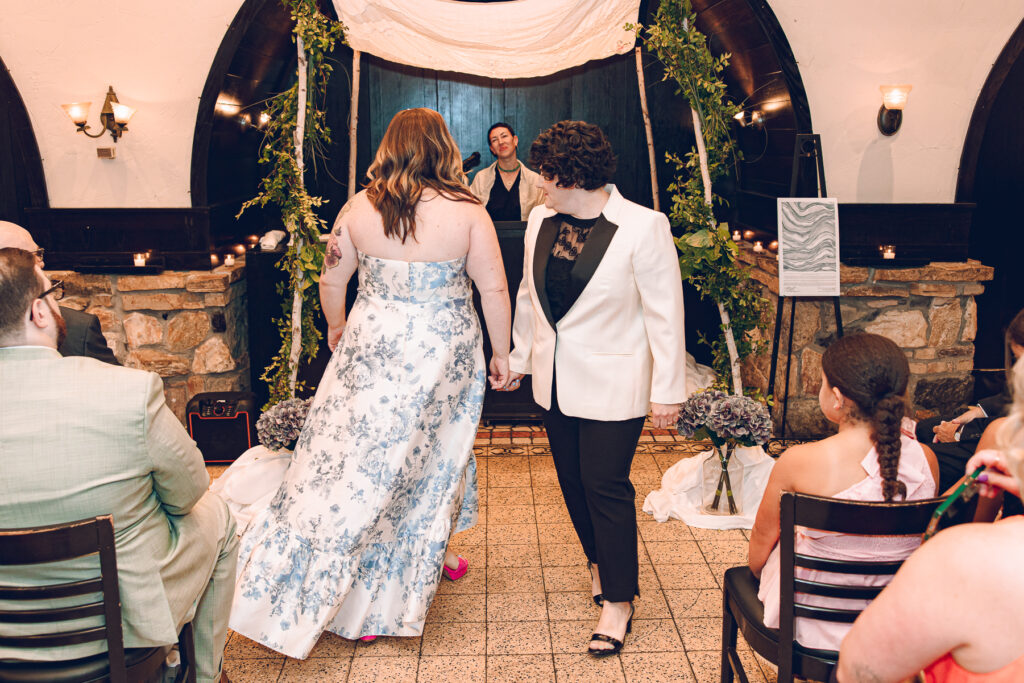 A queer couple celebrates their wedding at Osteria Via Stato