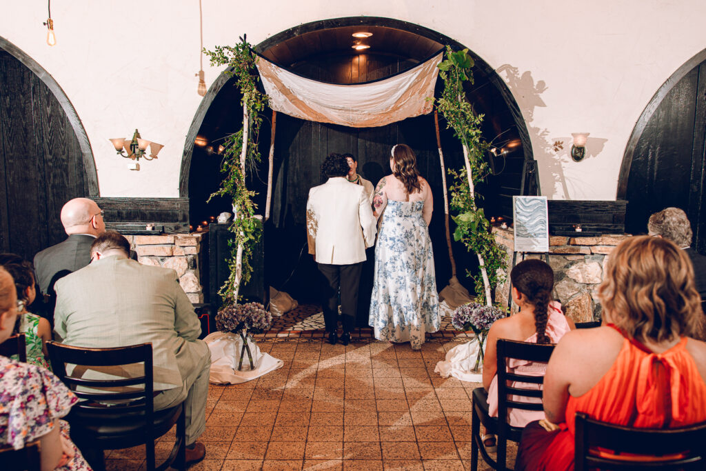 A queer couple celebrates their wedding at Osteria Via Stato