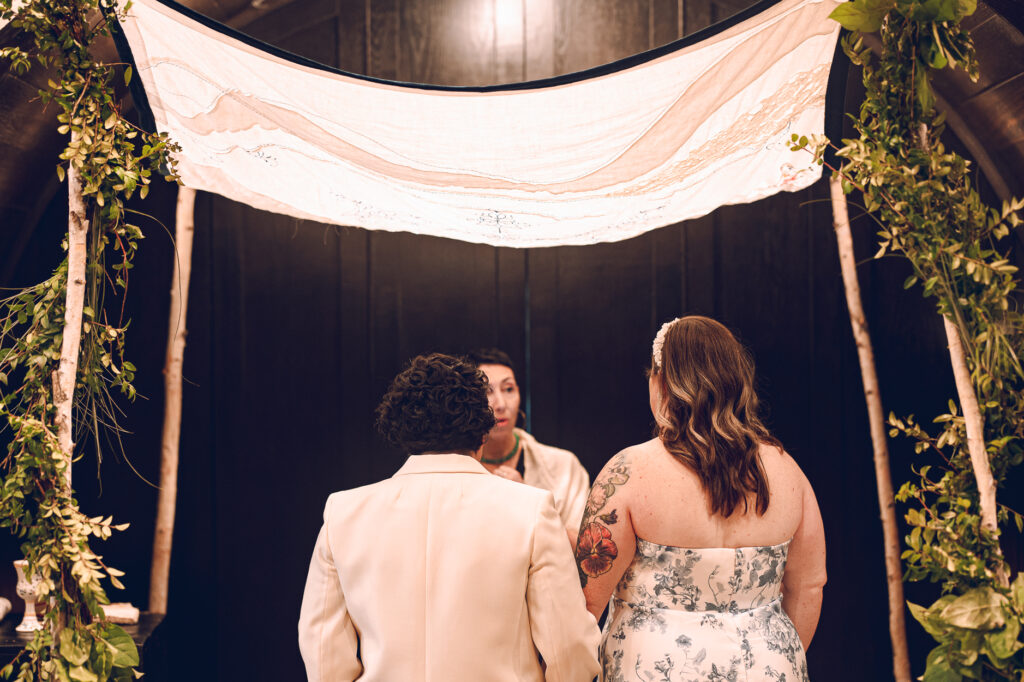 A queer couple celebrates their wedding at Osteria Via Stato