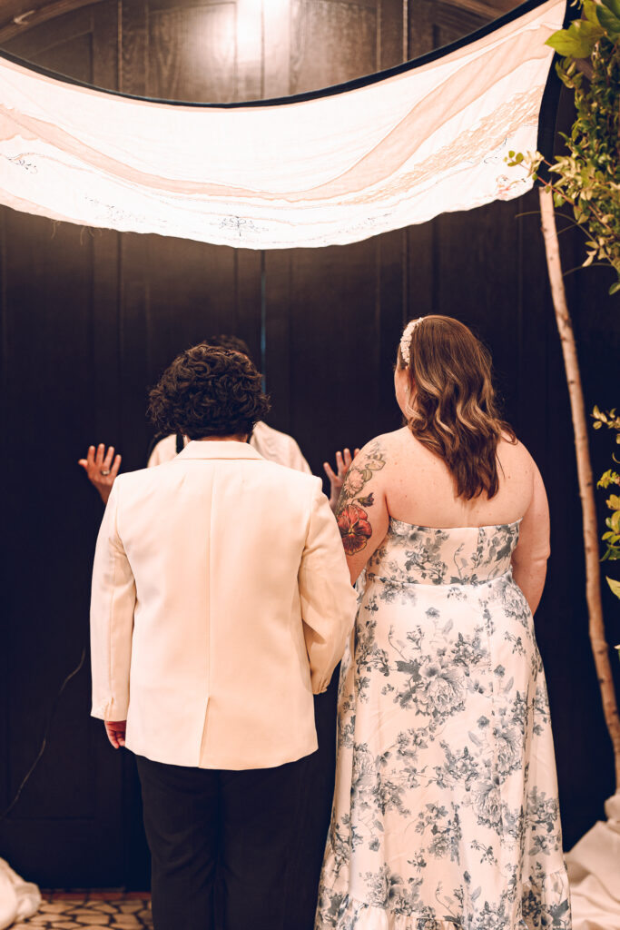 A queer couple celebrates their wedding at Osteria Via Stato