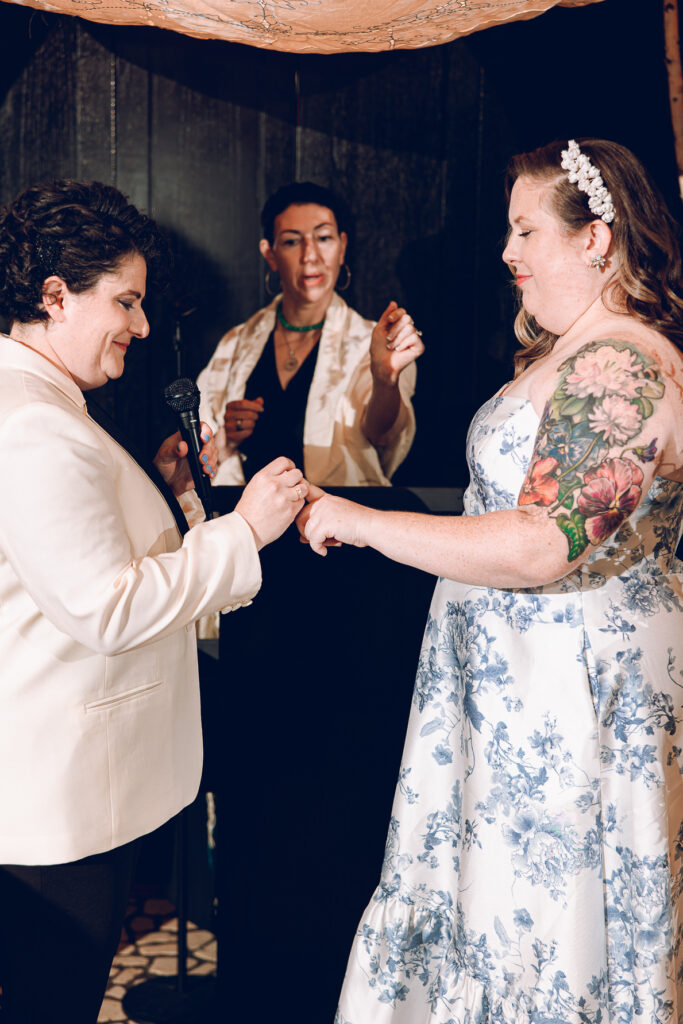 A queer couple celebrates their wedding at Osteria Via Stato