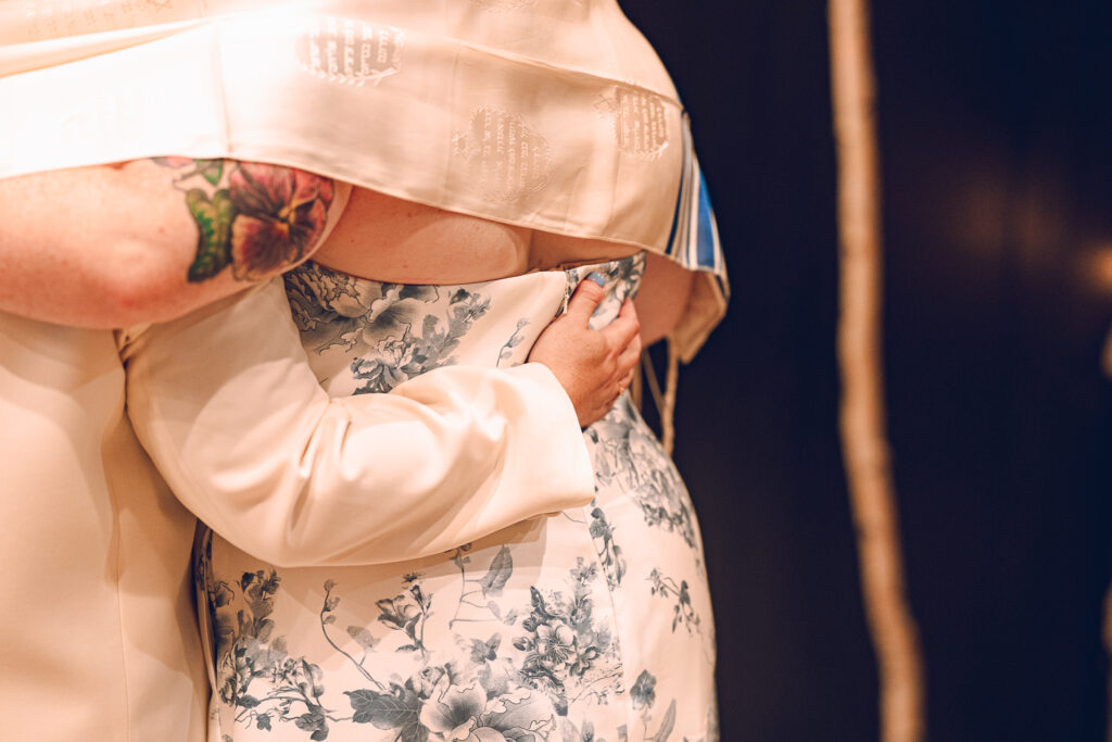 A queer couple celebrates their wedding at Osteria Via Stato