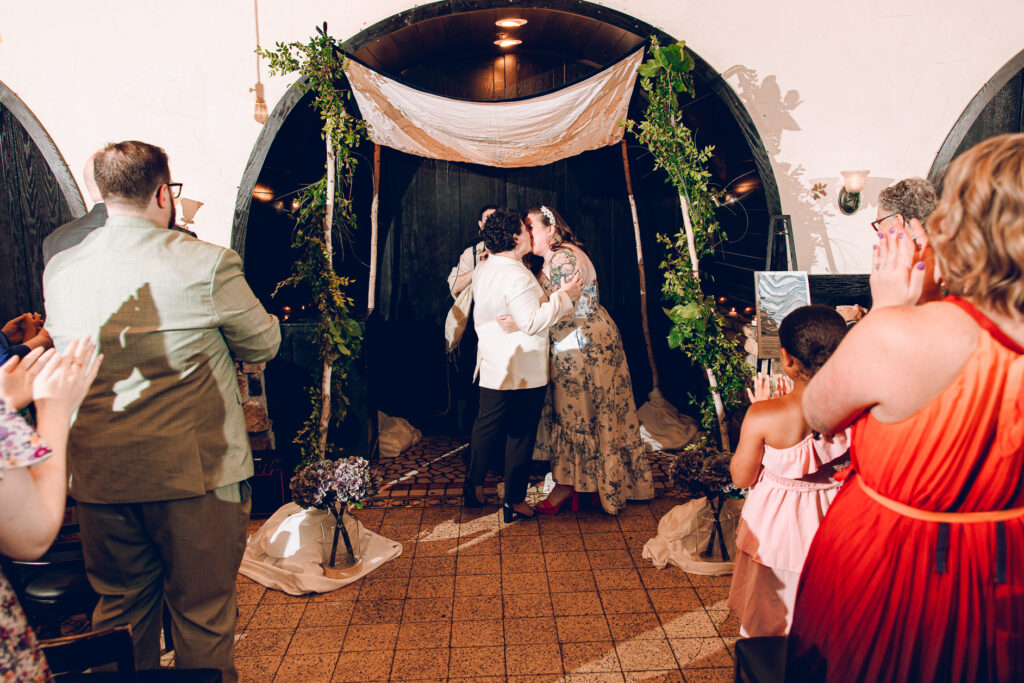 A queer couple celebrates their wedding at Osteria Via Stato