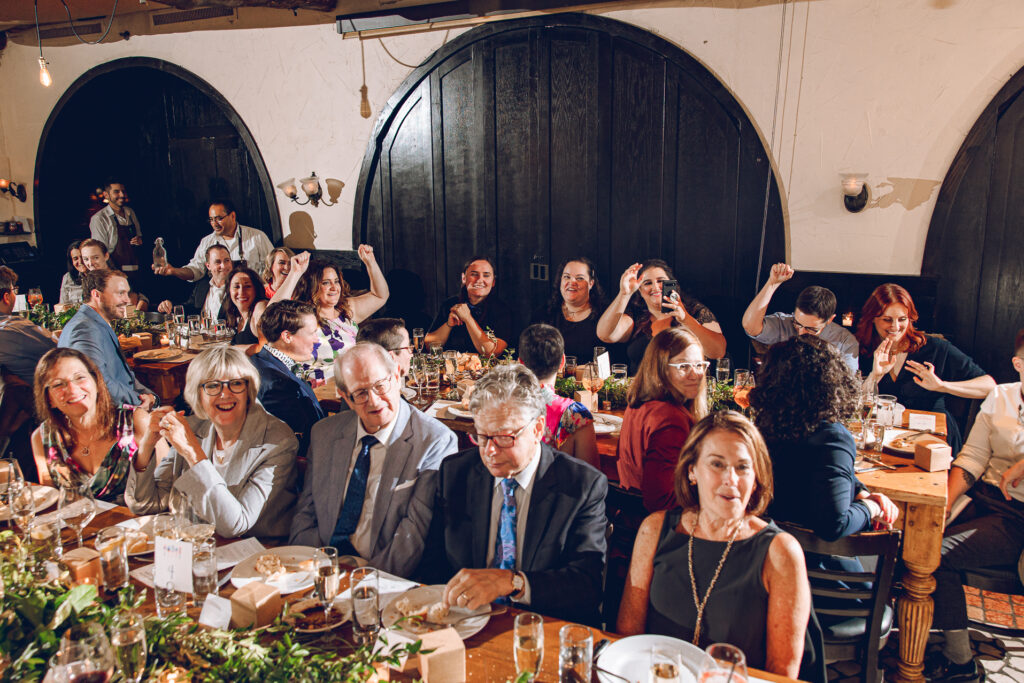 A queer couple celebrates their wedding at Osteria Via Stato