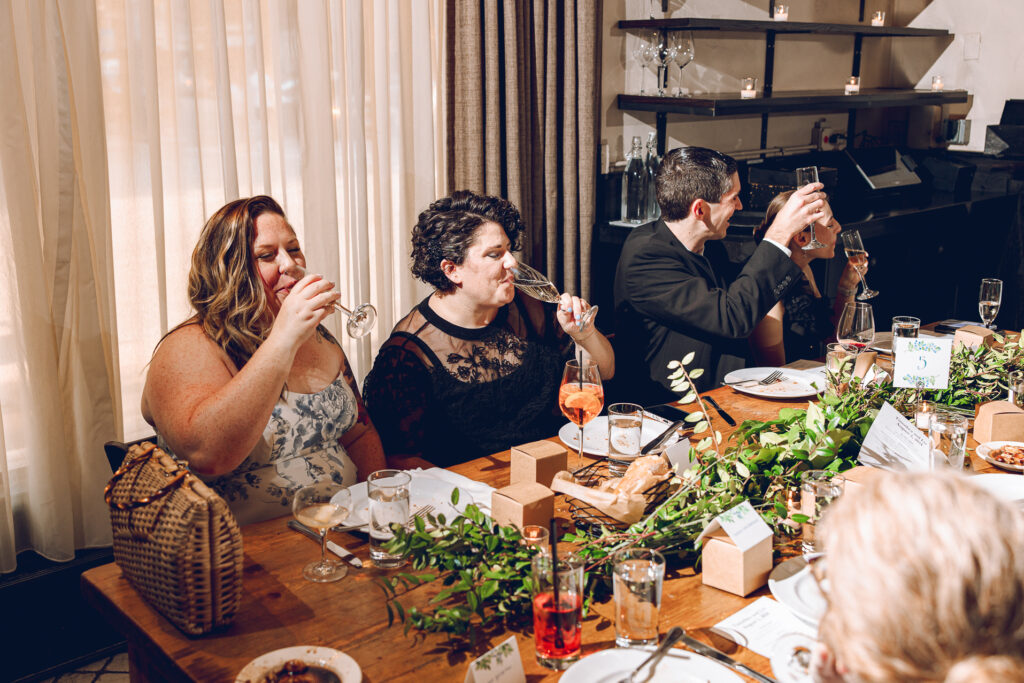 A queer couple celebrates their wedding at Osteria Via Stato