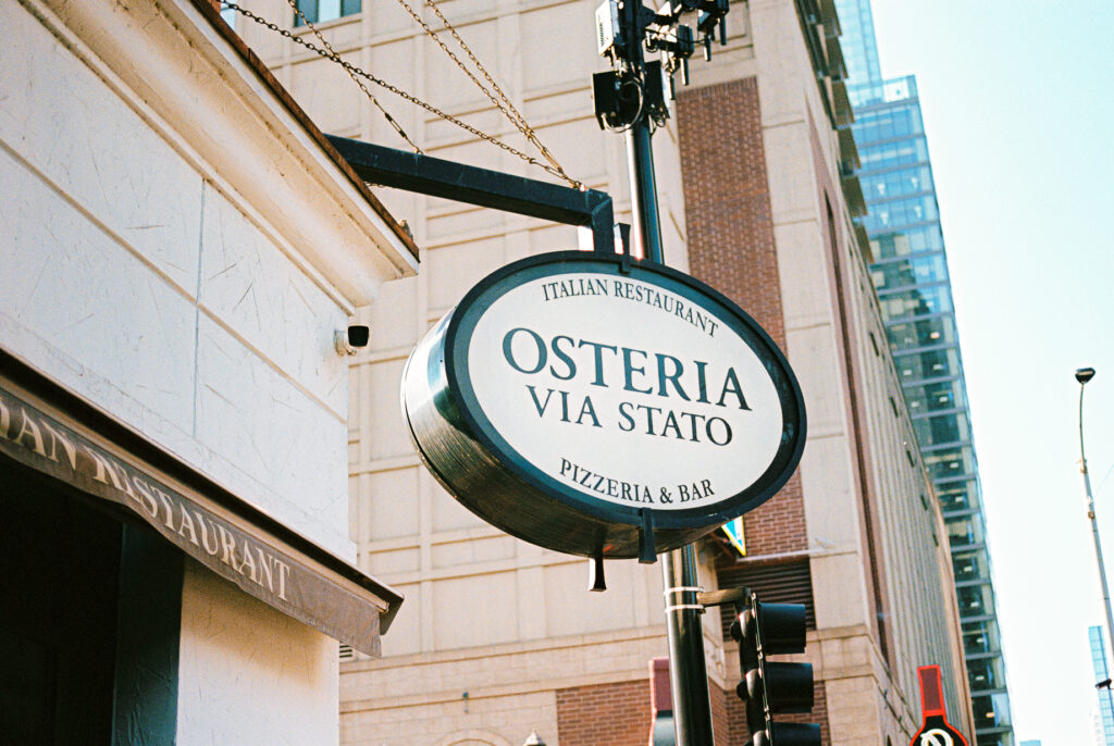 A queer couple celebrates their wedding at Osteria Via Stato