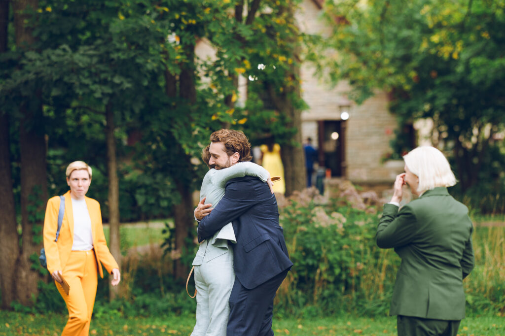A queer couple celebrates their wedding at The Grove Redfield Estate in Glenview, Illinois.