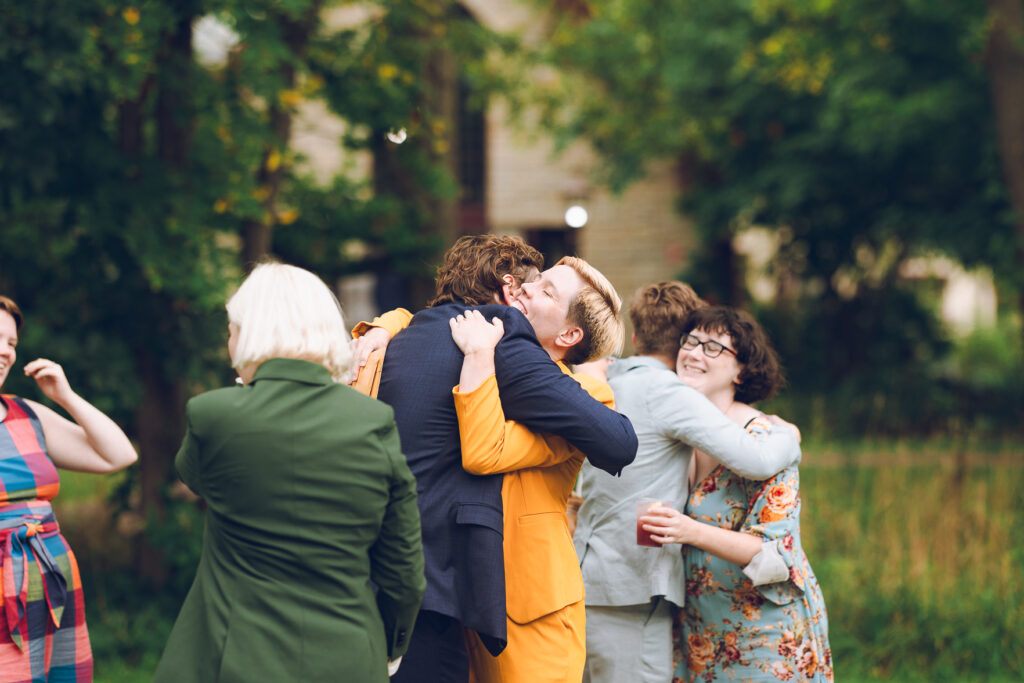 A queer couple celebrates their wedding at The Grove Redfield Estate in Glenview, Illinois.