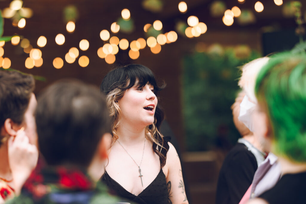 A queer couple celebrates their wedding at The Grove Redfield Estate in Glenview, Illinois.