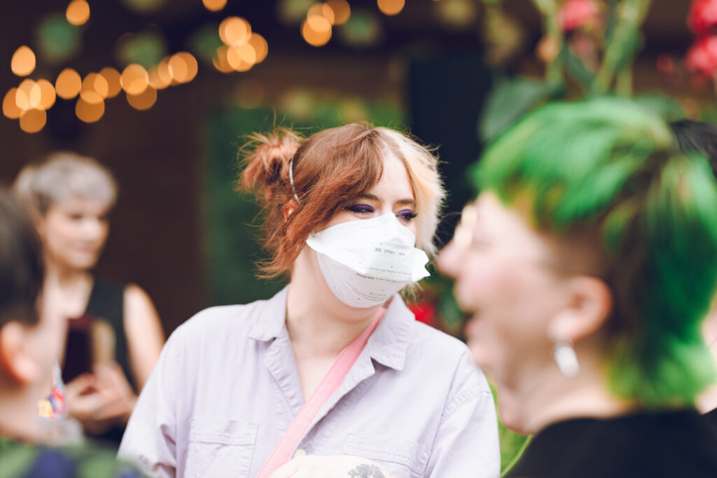 A queer couple celebrates their wedding at The Grove Redfield Estate in Glenview, Illinois.