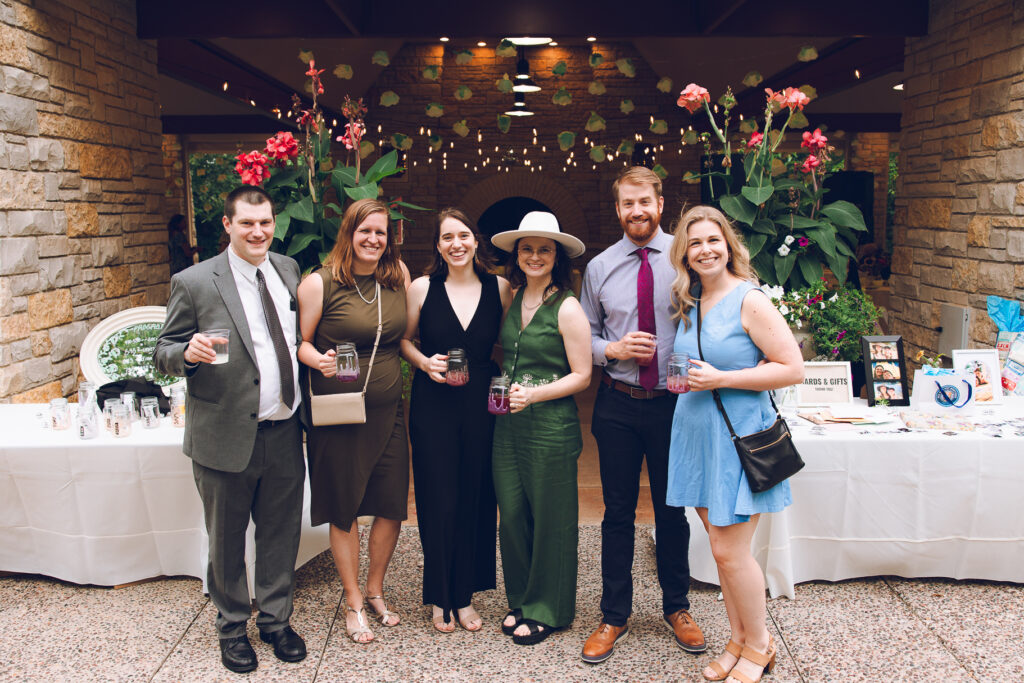 A queer couple celebrates their wedding at The Grove Redfield Estate in Glenview, Illinois.