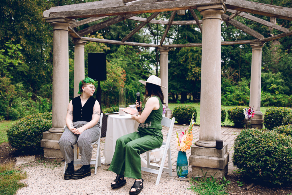 A queer couple celebrates their wedding at The Grove Redfield Estate in Glenview, Illinois.
