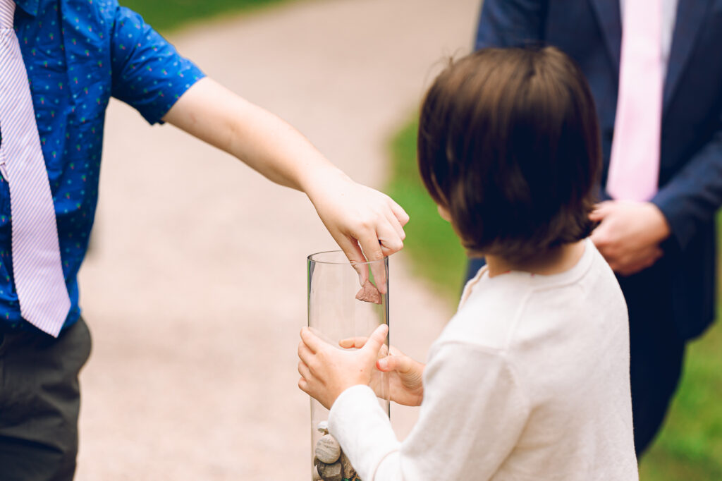 A queer couple celebrates their wedding at The Grove Redfield Estate in Glenview, Illinois.