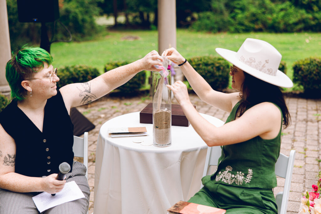 A queer couple celebrates their wedding at The Grove Redfield Estate in Glenview, Illinois.