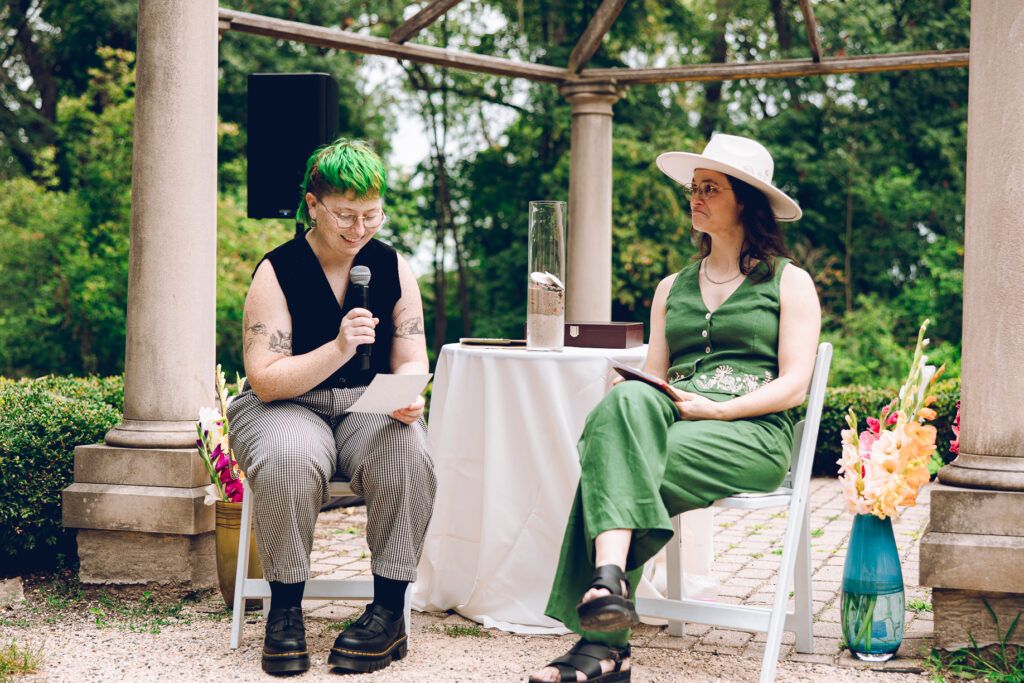 A queer couple celebrates their wedding at The Grove Redfield Estate in Glenview, Illinois.