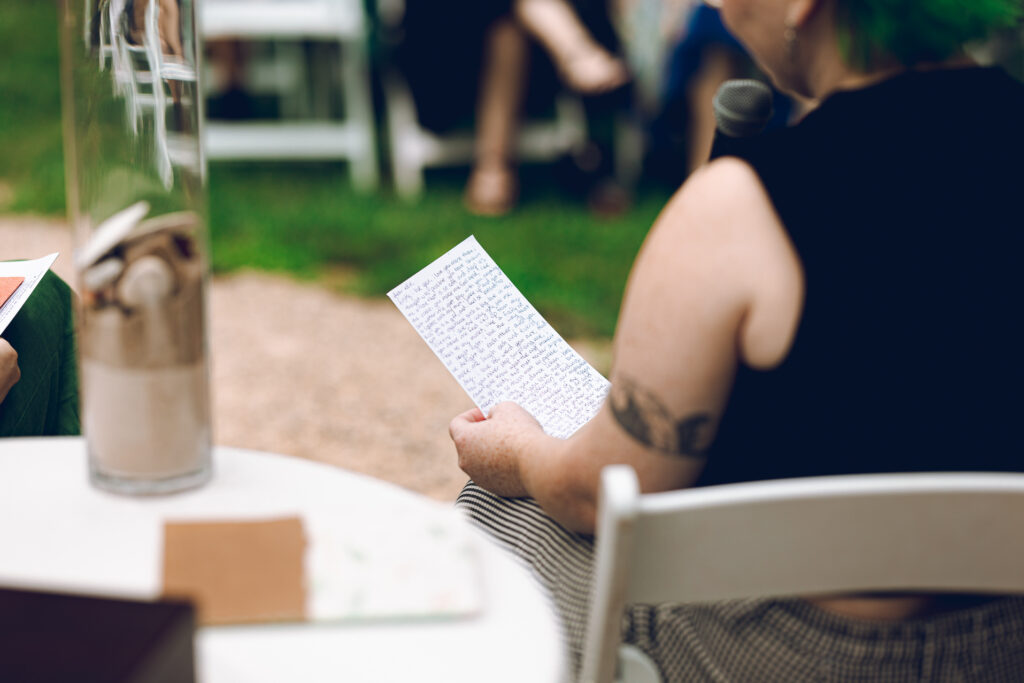 A queer couple celebrates their wedding at The Grove Redfield Estate in Glenview, Illinois.