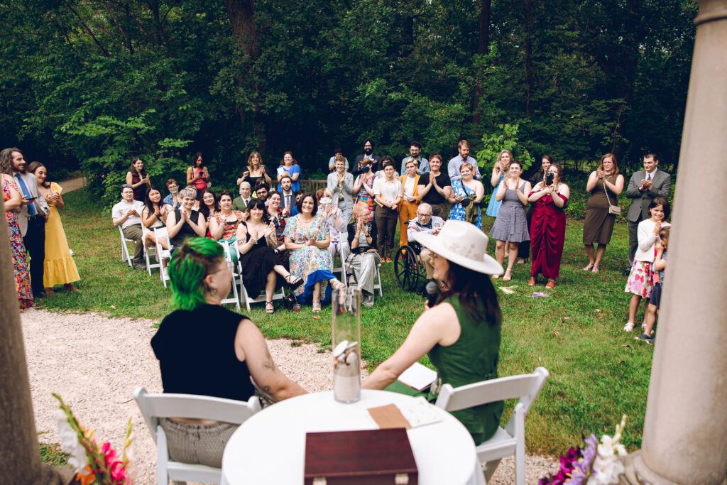 A queer couple celebrates their wedding at The Grove Redfield Estate in Glenview, Illinois.