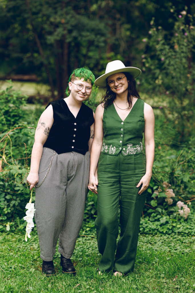 A queer couple celebrates their wedding at The Grove Redfield Estate in Glenview, Illinois.