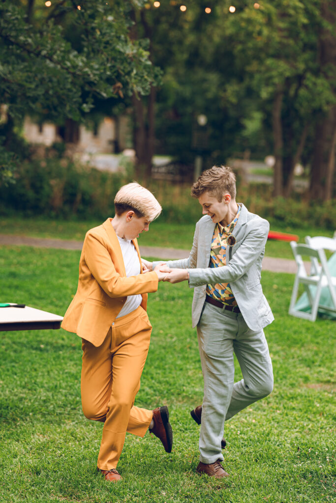 A queer couple celebrates their wedding at The Grove Redfield Estate in Glenview, Illinois.