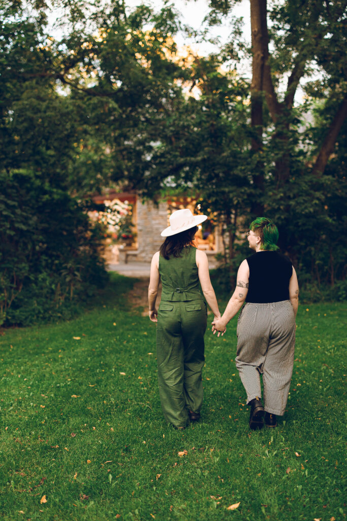 A queer couple celebrates their wedding at The Grove Redfield Estate in Glenview, Illinois.