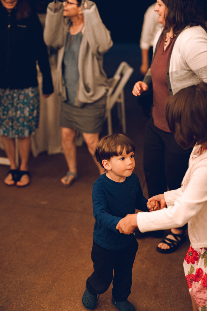 A queer couple celebrates their wedding at The Grove Redfield Estate in Glenview, Illinois.