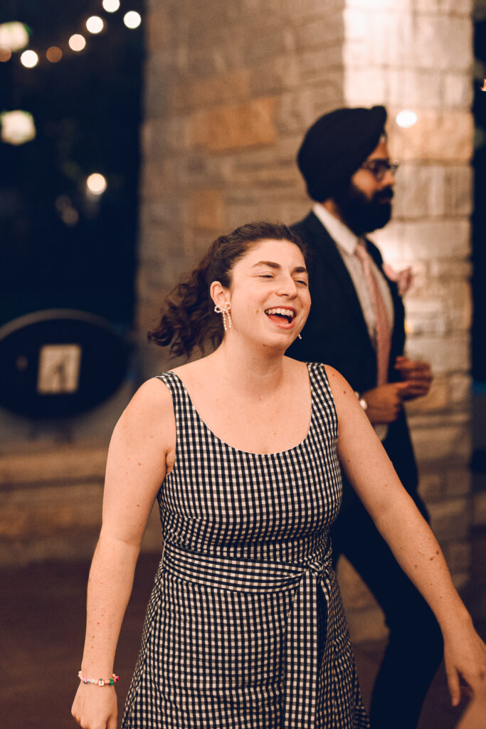 A queer couple celebrates their wedding at The Grove Redfield Estate in Glenview, Illinois.