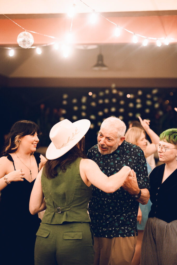 A queer couple celebrates their wedding at The Grove Redfield Estate in Glenview, Illinois.